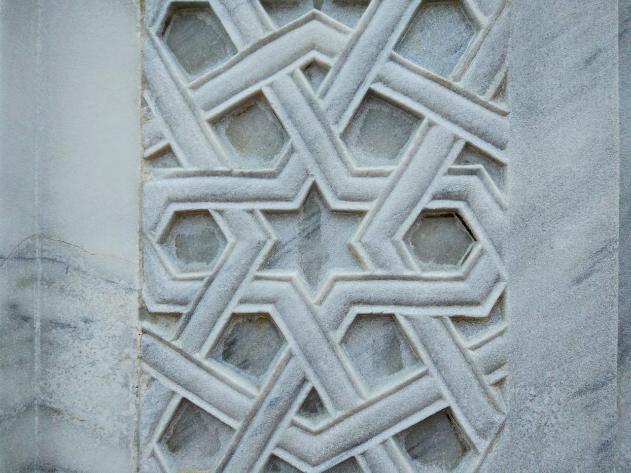 contact-img Close-up of intricate marble geometric pattern in Bursa, Türkiye, showcasing traditional Islamic artistry.